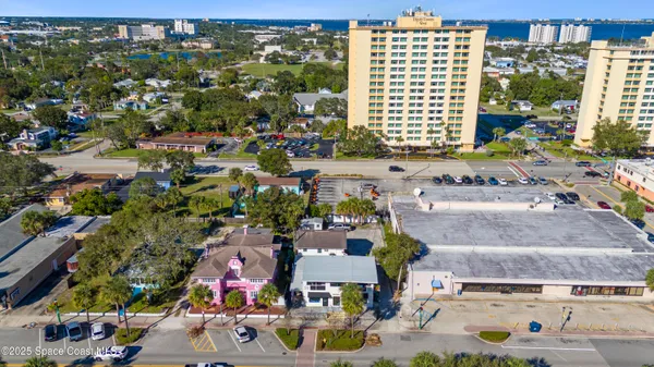 an aerial view of residential houses with outdoor space