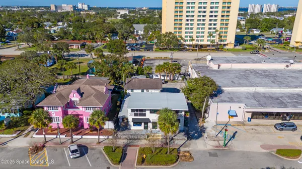 an aerial view of houses with yard