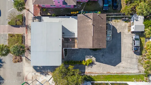 a aerial view of a house with a yard