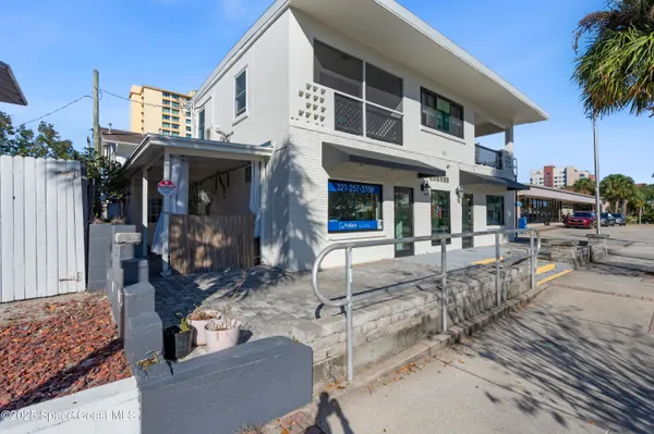 a view of a building with sitting area