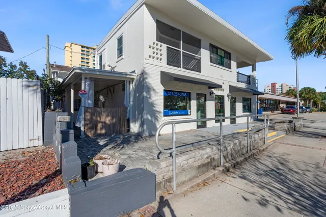 a view of a building with sitting area