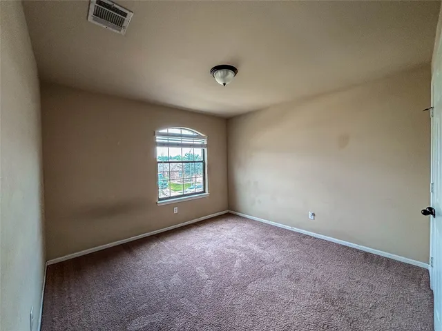 front view of a house with a small yard