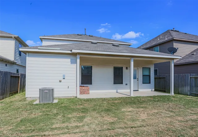 a bathroom with a tub double sink and mirror