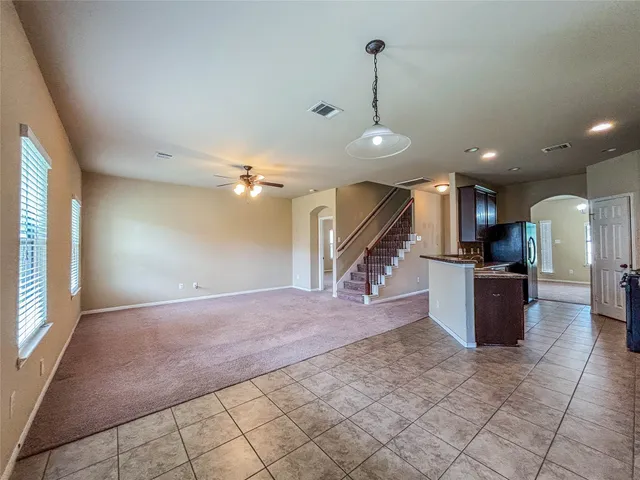 a view of a kitchen with a sink and a fireplace