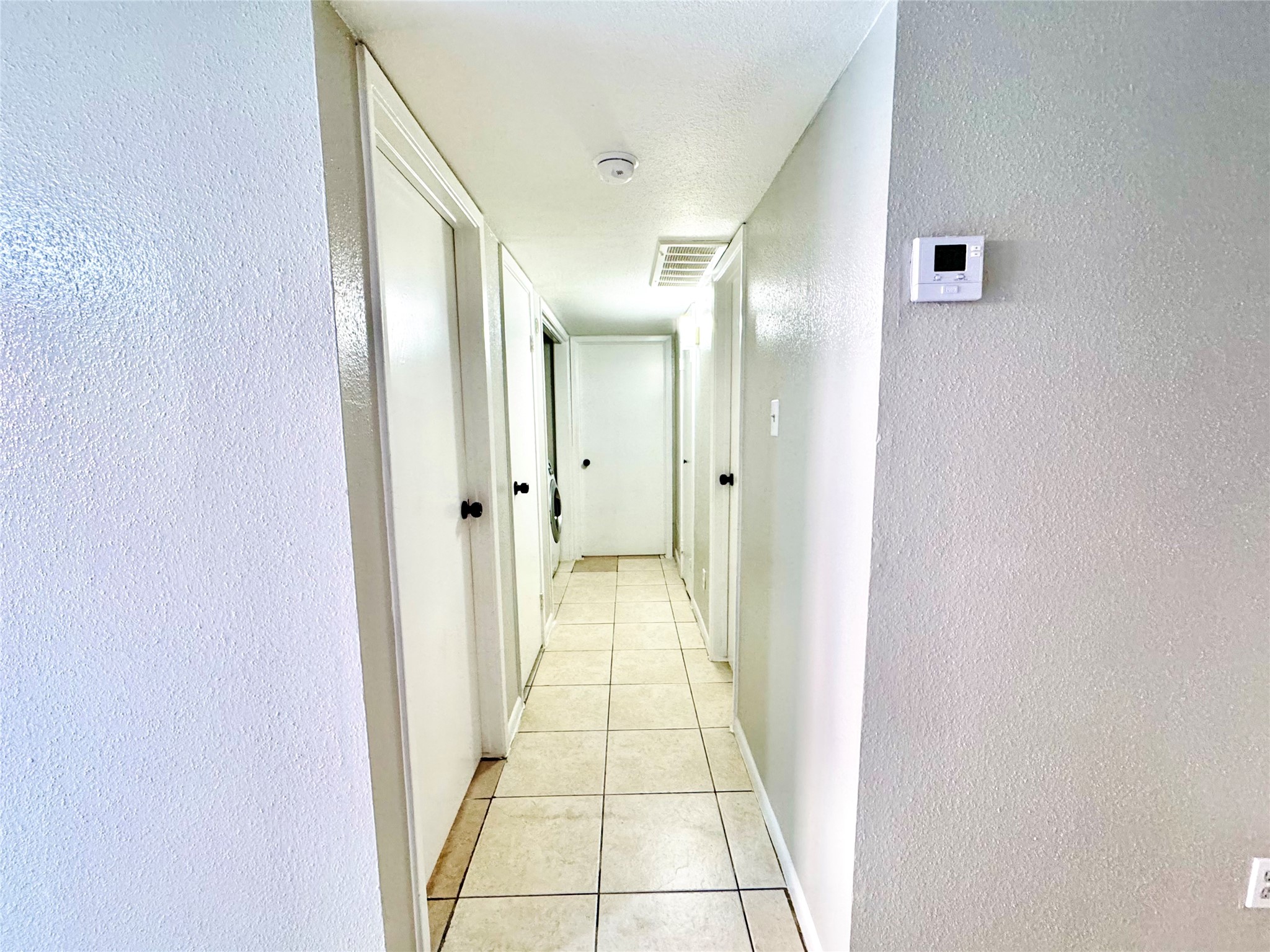 9090 South Braeswood Boulevard, Unit 47 Houston, TX 77074 - Photo 19 of 30 a view of a hallway