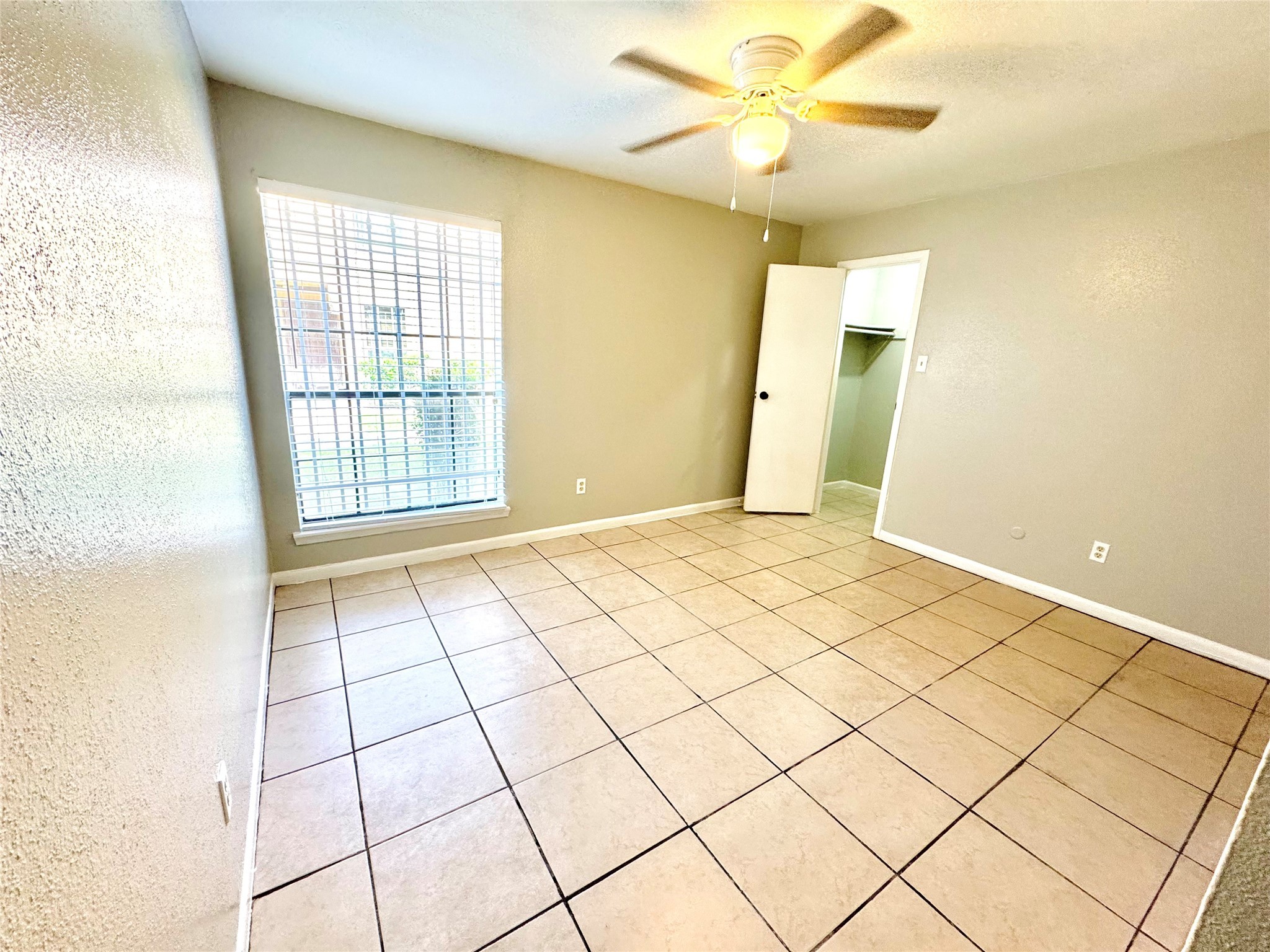 9090 South Braeswood Boulevard, Unit 47 Houston, TX 77074 - Photo 20 of 30 a view of an empty room with a window