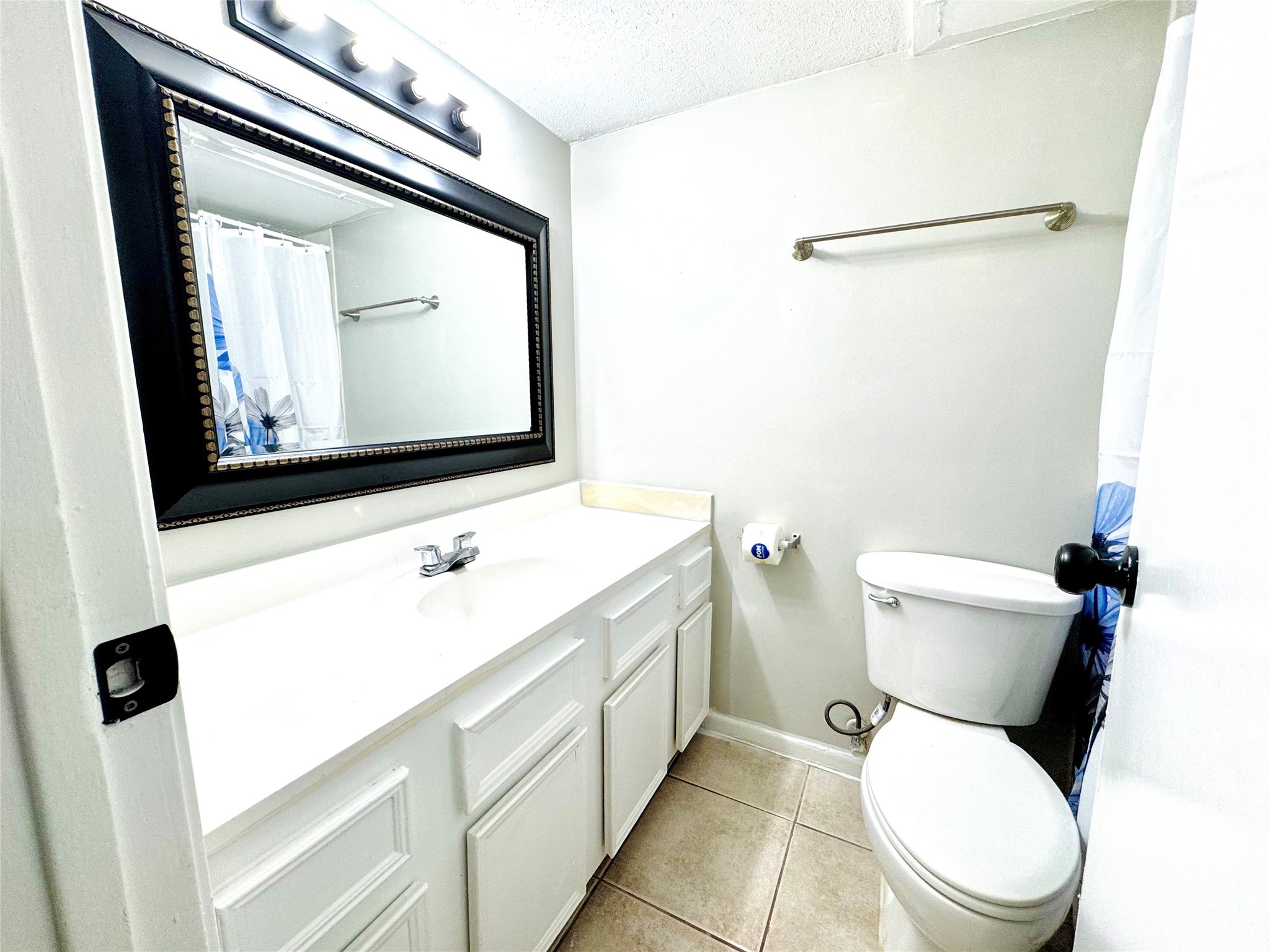 9090 South Braeswood Boulevard, Unit 47 Houston, TX 77074 - Photo 2 of 30 a white toilet sitting next to a bathroom sink