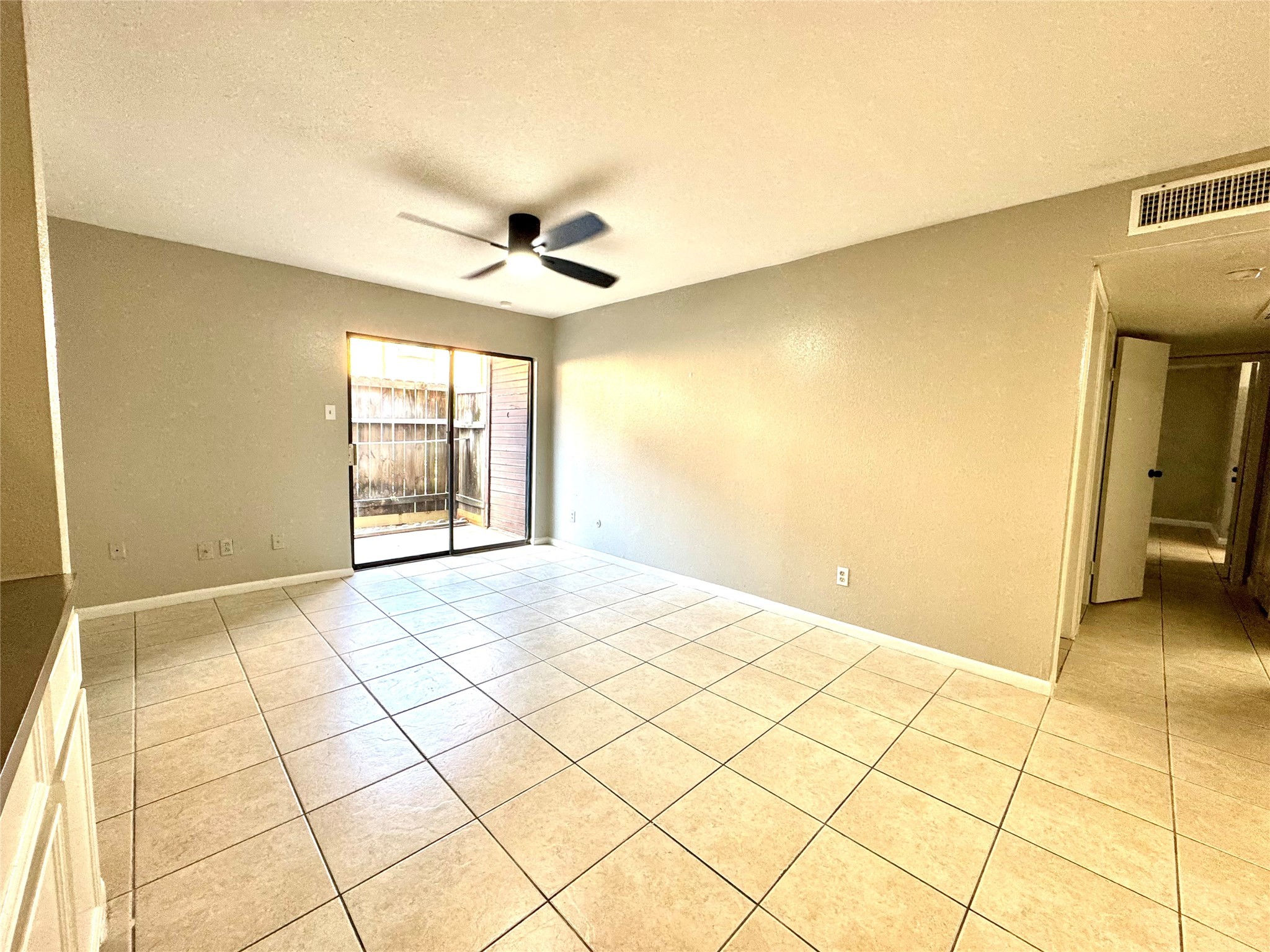 9090 South Braeswood Boulevard, Unit 47 Houston, TX 77074 - Photo 26 of 30 a view of an empty room with a window