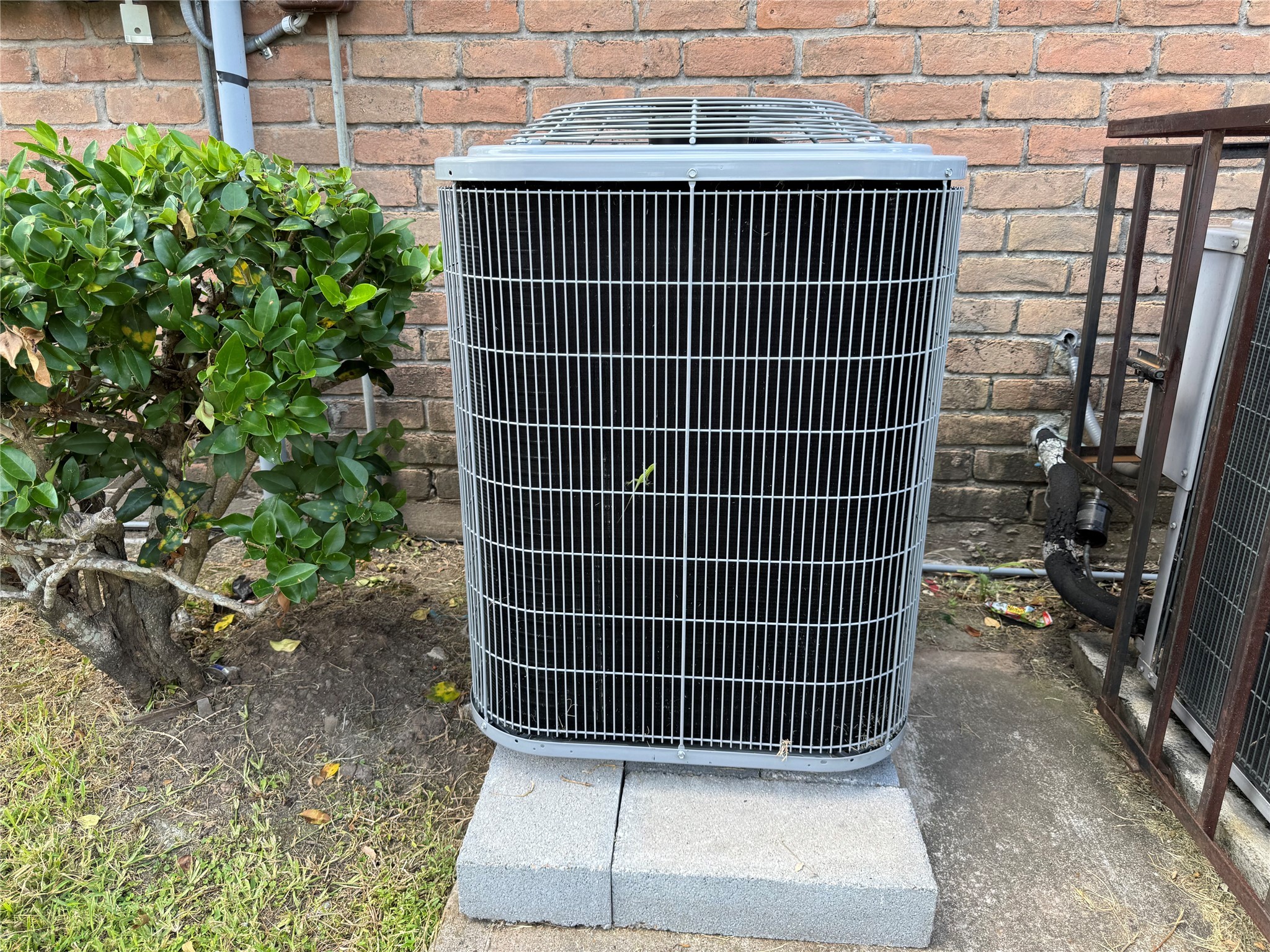 9090 South Braeswood Boulevard, Unit 47 Houston, TX 77074 - Photo 28 of 30 a view of a door with a door and wooden bench