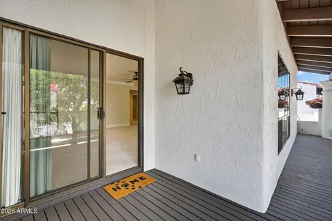 a bathroom with a mirror sink and glass door shower
