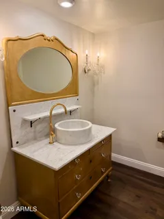 a view of walk in closet with wooden floor