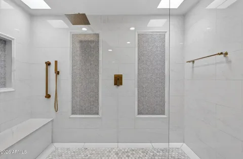 a bathroom with a sink and mirror