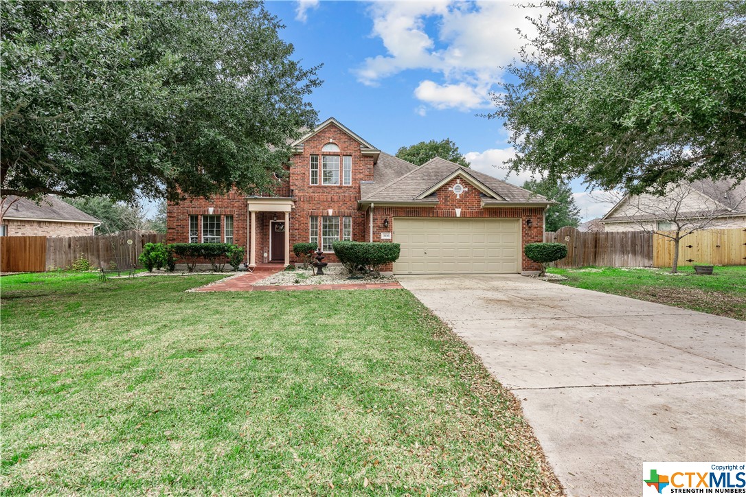 3336 Ashleys Way Marion, TX 78124 - Photo 1 of 1 a front view of a house with a yard and garage