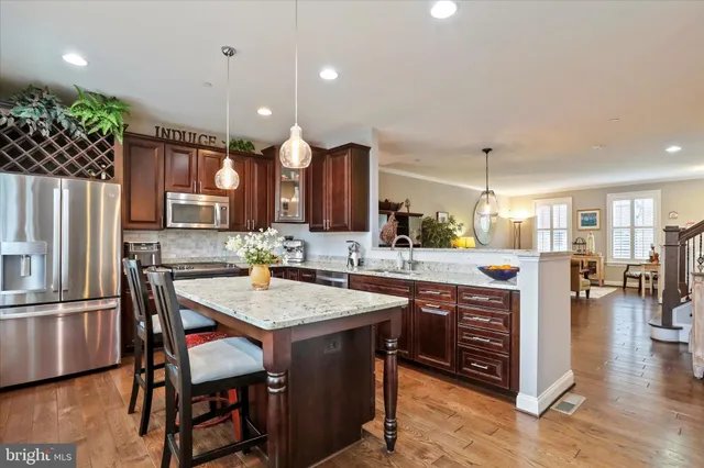 a kitchen with a stove a sink and a refrigerator