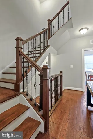 a bathroom with a granite countertop sink a large mirror and a shower