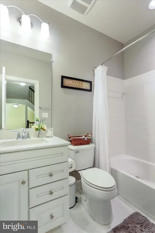 a view of a bedroom with furniture and closet