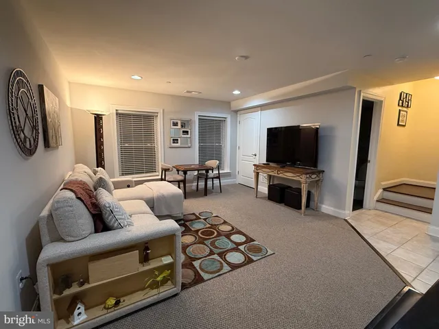 a bedroom with a bed and a television