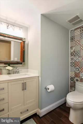 a living room with furniture a dining table and a large window