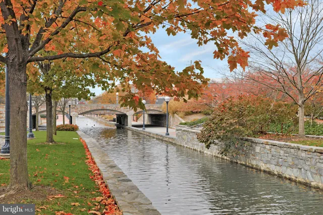 a swimming pool with outdoor seating and yard