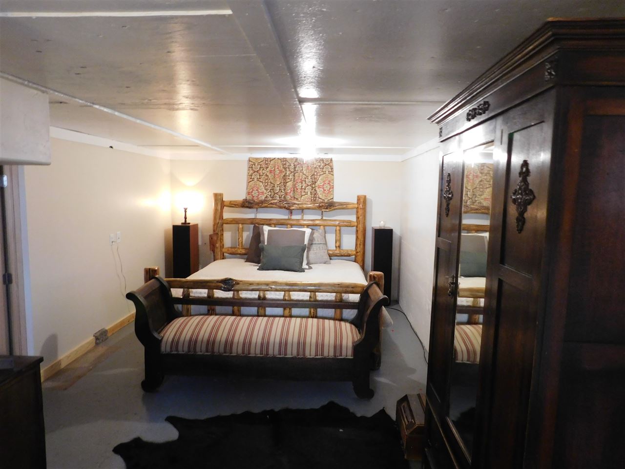 1640 P Road Loma, CO 81524 - Photo 11 of 40 a bedroom with a bed and wooden floor