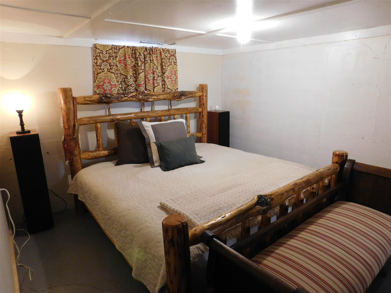 1640 P Road Loma, CO 81524 - Photo 12 of 40 a bedroom with a bed and wooden floor