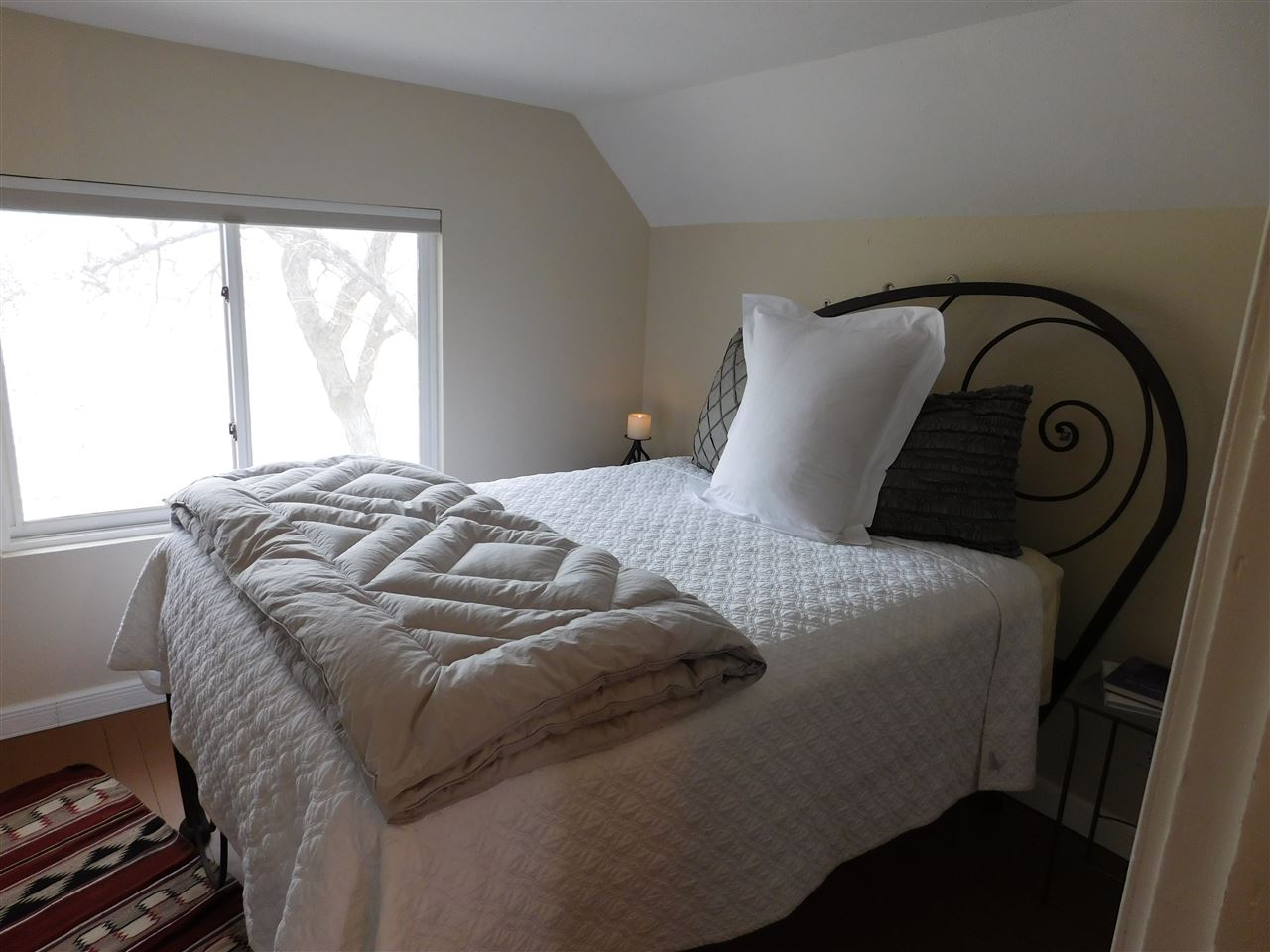1640 P Road Loma, CO 81524 - Photo 14 of 40 a bedroom with a bed and window