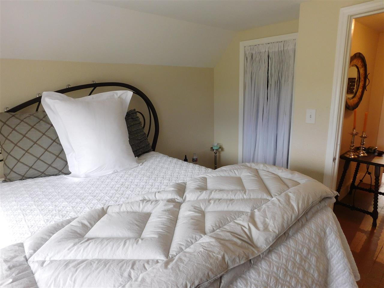 1640 P Road Loma, CO 81524 - Photo 15 of 40 a bedroom with a bed and a dresser