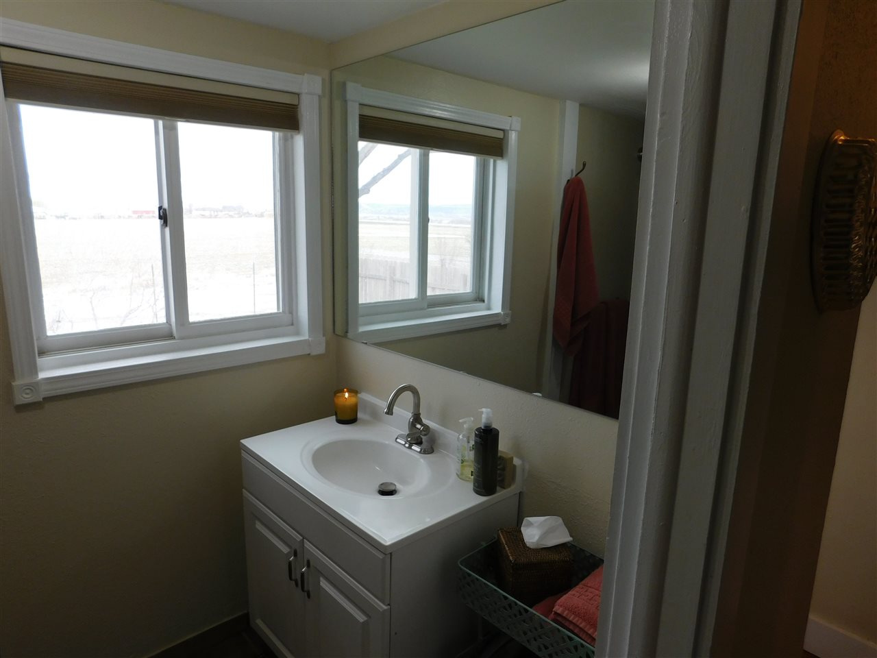 1640 P Road Loma, CO 81524 - Photo 19 of 40 a bathroom with a sink toilet and a mirror