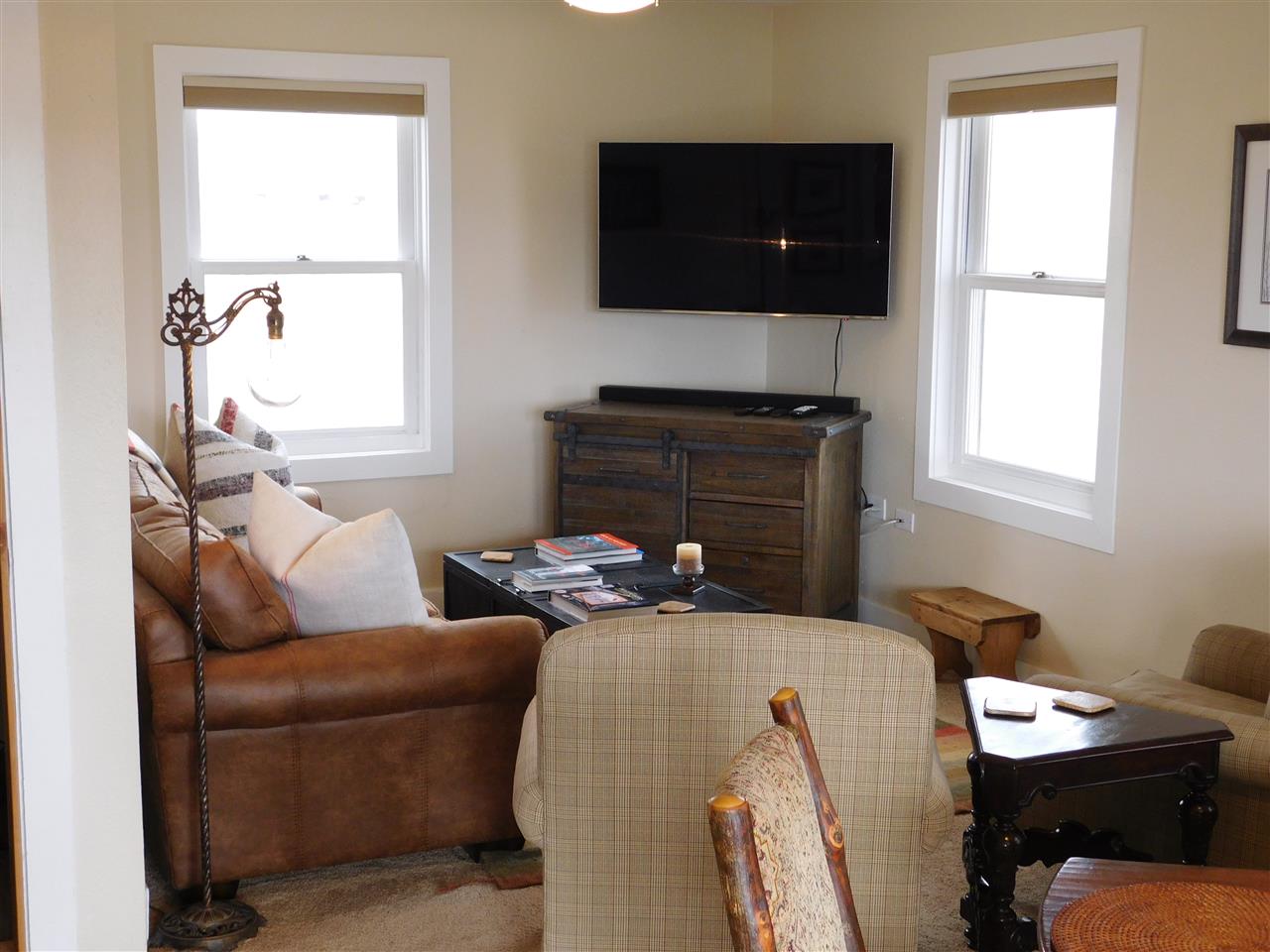 1640 P Road Loma, CO 81524 - Photo 7 of 40 a living room with furniture a flat screen tv and a window