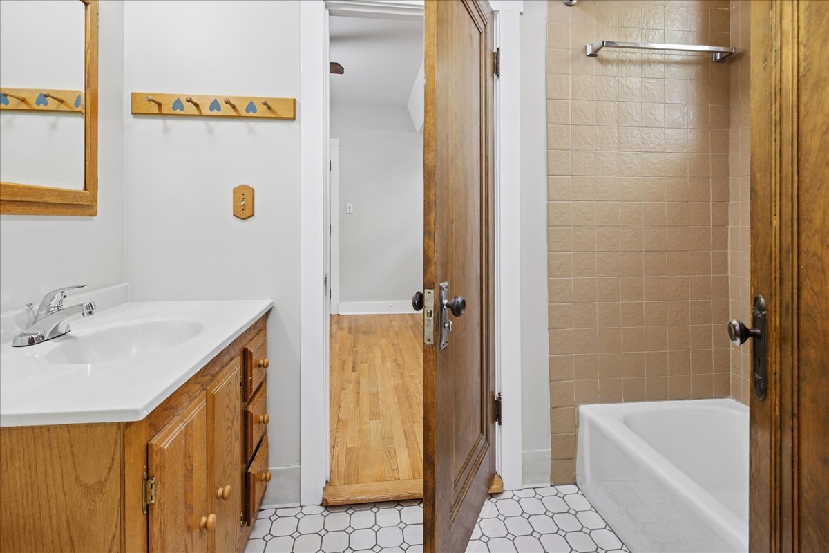 734 West Wrightwood Avenue, Unit B Chicago, IL 60614 - Photo 14 of 21 a bathroom with a sink and a shower