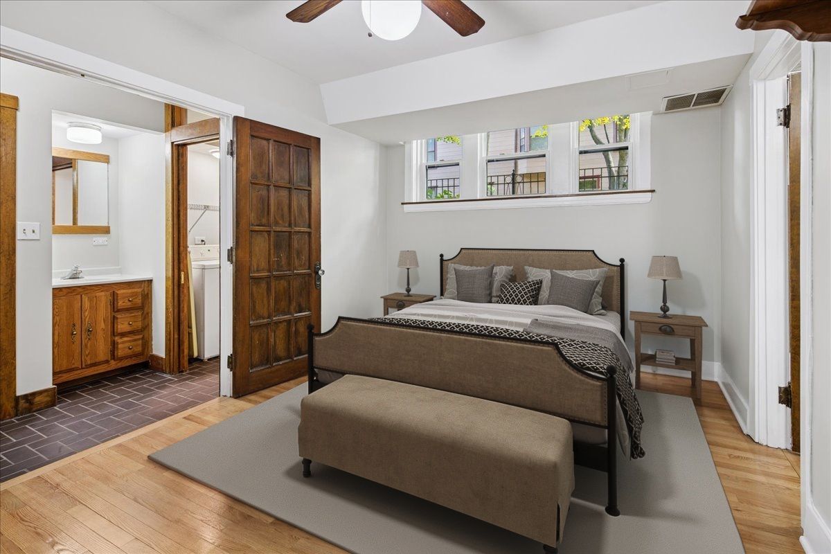 734 West Wrightwood Avenue, Unit B Chicago, IL 60614 - Photo 15 of 21 a bedroom with a bed and wooden floor