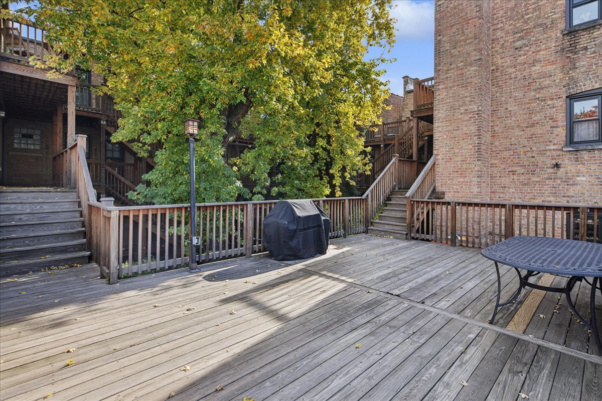 734 West Wrightwood Avenue, Unit B Chicago, IL 60614 - Photo 19 of 21 a balcony with wooden floor and outdoor space