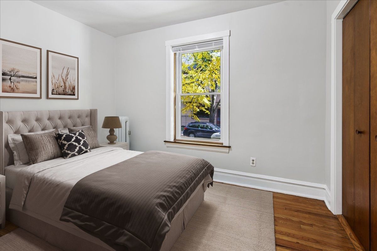 734 West Wrightwood Avenue, Unit B Chicago, IL 60614 - Photo 8 of 21 a bedroom with a bed and a window