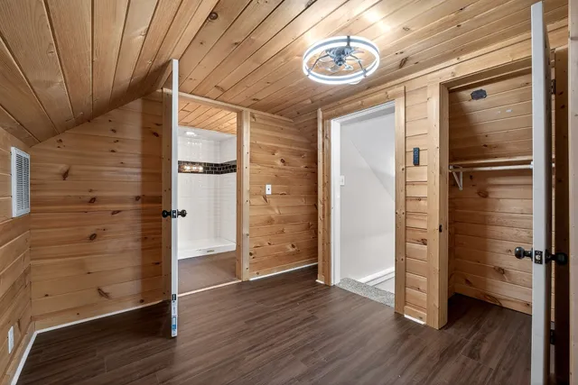 an empty room with wooden floor