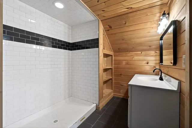a bathroom with a sink and a shower