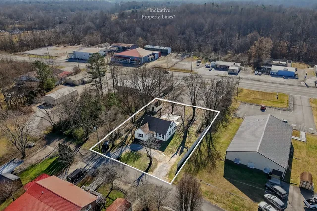 a view of a house with a yard deck and a patio