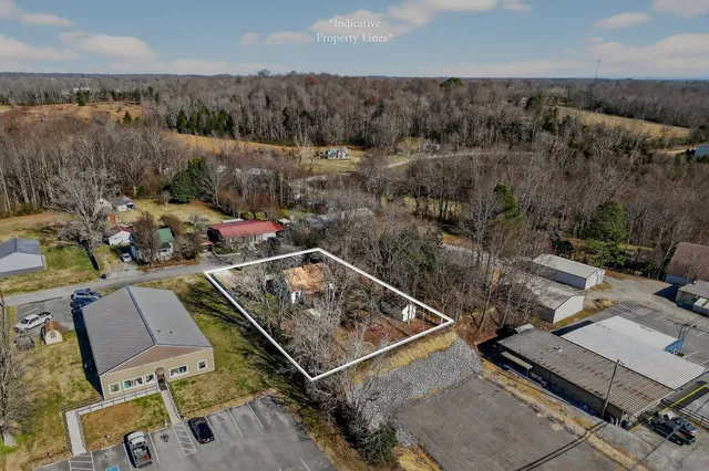 an aerial view of residential building with parking