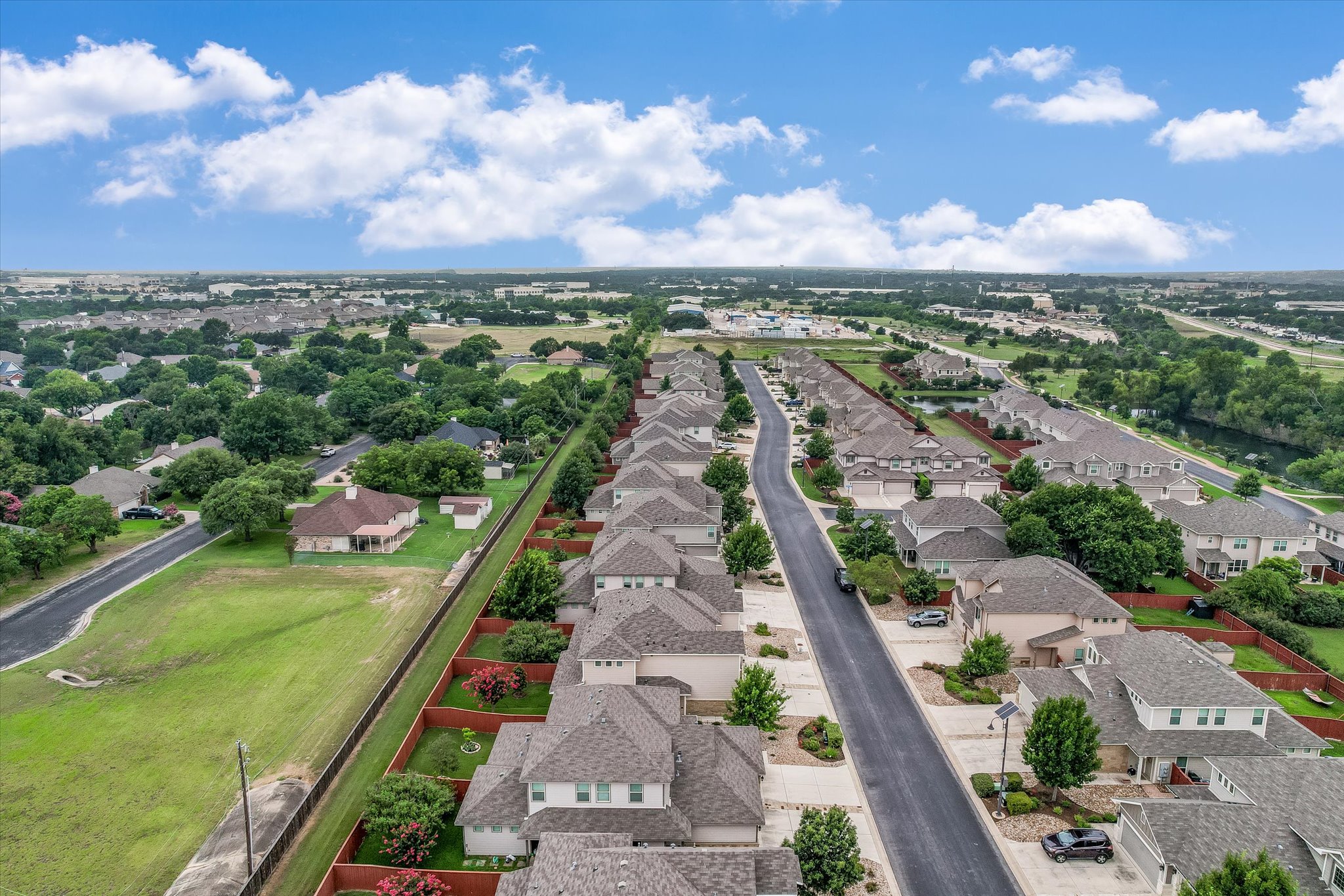528 High Tech Drive Georgetown, TX 78626 - Photo 3 of 29 Peaceful, upscale townhome community six minutes from Georgetown Square. Looking east toward I-35.