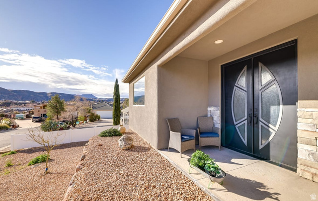 217 West Terrace Circle Toquerville, UT 84774 - Photo 22 of 25 Doorway to property featuring french doors, a mountain view, and stucco siding