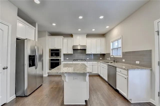 a large kitchen with cabinets