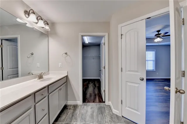 a bathroom with a double vanity sink and a mirror