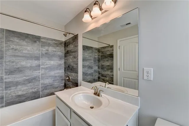 a bathroom with a sink and a bathtub