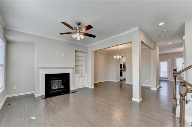a view of an empty room and fire place