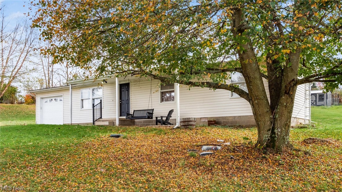 1730 Mollies Rock Road Dresden, OH 43821 - Photo 1 of 24 View of front facade featuring a garage