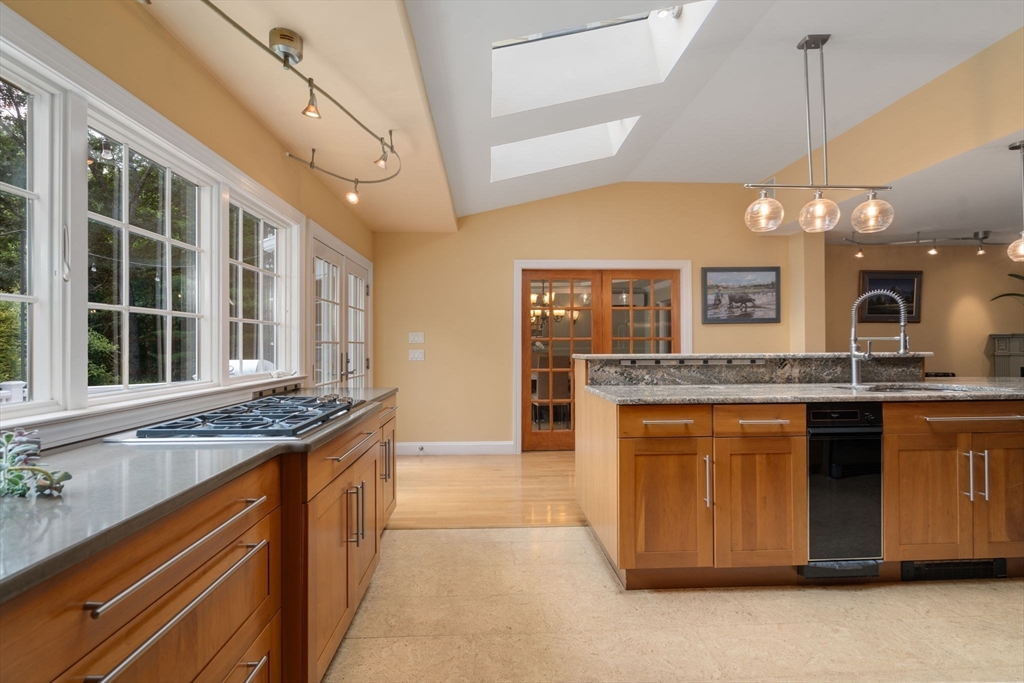 24 Russett Hill Road Sherborn, MA 01770 - Photo 9 of 39 a kitchen with stainless steel appliances granite countertop a sink and a stove