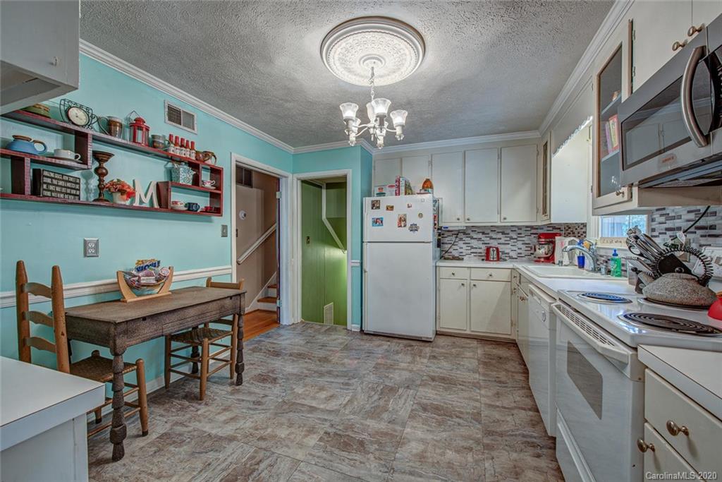 912 Parkwood Road Shelby, NC 28150 - Photo 11 of 23 a kitchen with cabinets a island and appliances in it