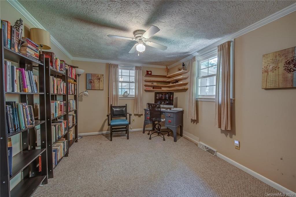 912 Parkwood Road Shelby, NC 28150 - Photo 15 of 23 a view of a livingroom with furniture and a ceiling fan
