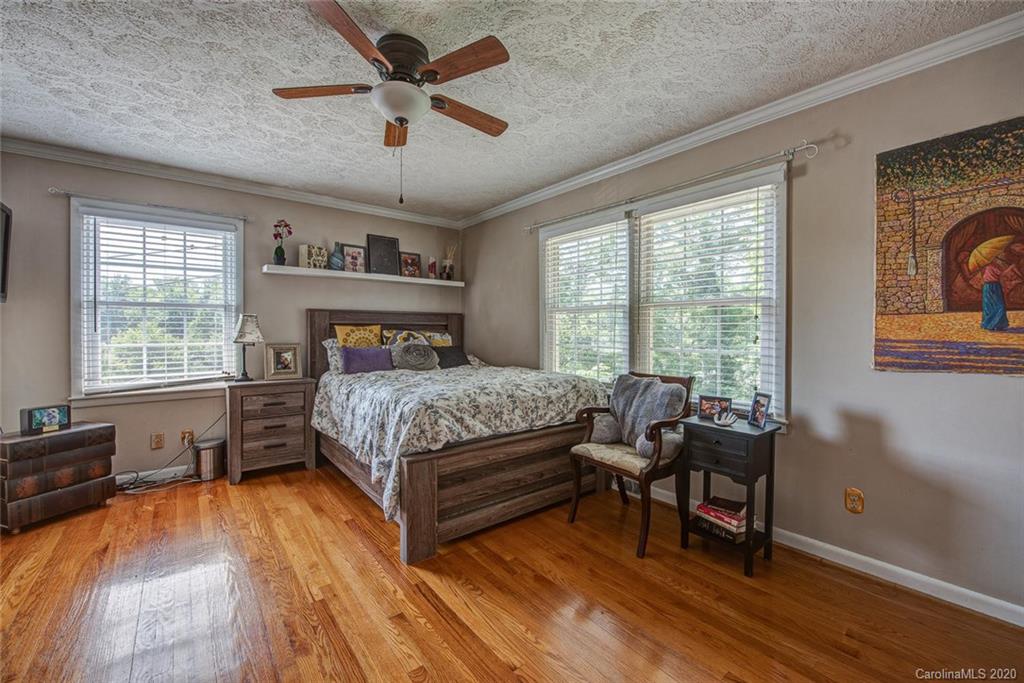 912 Parkwood Road Shelby, NC 28150 - Photo 17 of 23 a bedroom with a bed and a large window