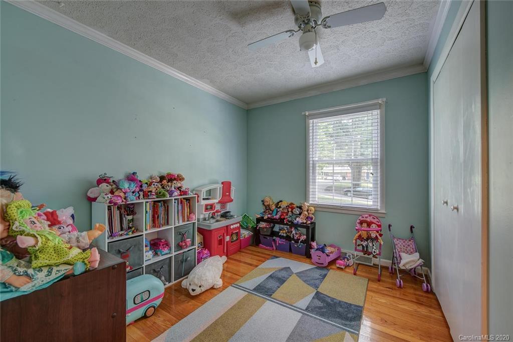 912 Parkwood Road Shelby, NC 28150 - Photo 18 of 23 a living room filled with furniture and a wooden floor