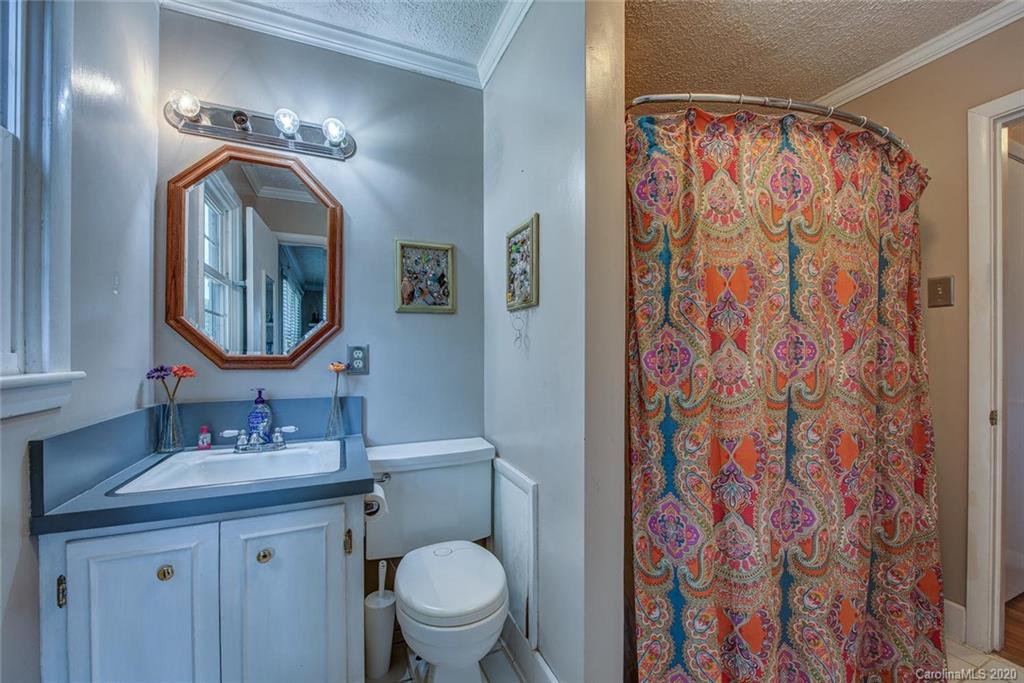 912 Parkwood Road Shelby, NC 28150 - Photo 20 of 23 a bathroom with a double vanity sink mirror and toilet